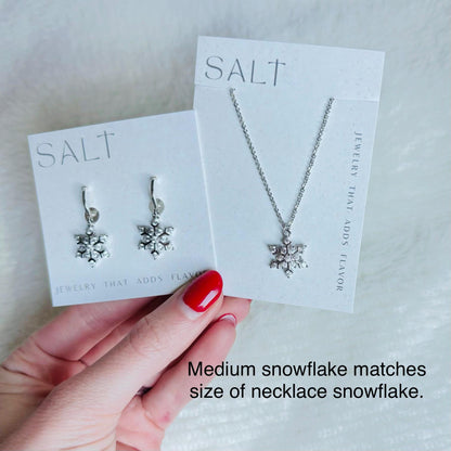 SILVER SNOWFLAKE HUGGIES | silver snow flake hoop earrings | holiday jewelry | sparkly Christmas earrings | chic snowflake hoops | platinum