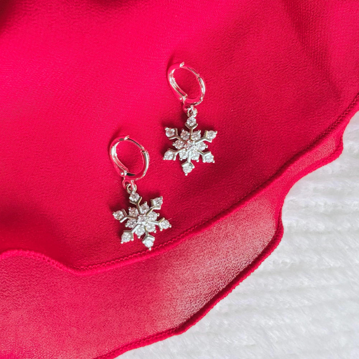 SILVER SNOWFLAKE HUGGIES | silver snow flake hoop earrings | holiday jewelry | sparkly Christmas earrings | chic snowflake hoops | platinum