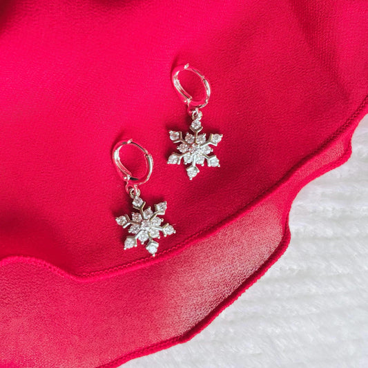 SILVER SNOWFLAKE HUGGIES | silver snow flake hoop earrings | holiday jewelry | sparkly Christmas earrings | chic snowflake hoops | platinum